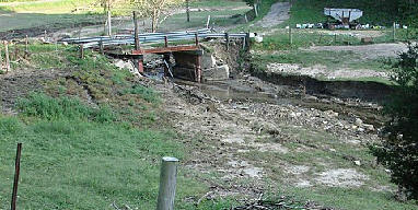 Throughout the coulee region along the upper Mississippi River, rampaging creeks left bridges in tatters. Note the scouring of earth far from the normally meandering stream. Streams that were normally 1.5 feet wide, became torrents 50 feet wide!