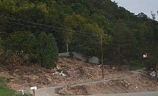 Only debris remains when clay and silt is turned to gelatin during 15" rainfall south of La Crosse... the house that was sitting there goes down hill with it.