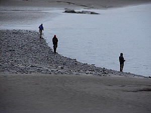 Fishermen line the freshwater creeks in "combat" style as salmon do their annual spawning run.