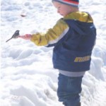 child with chickadee winter